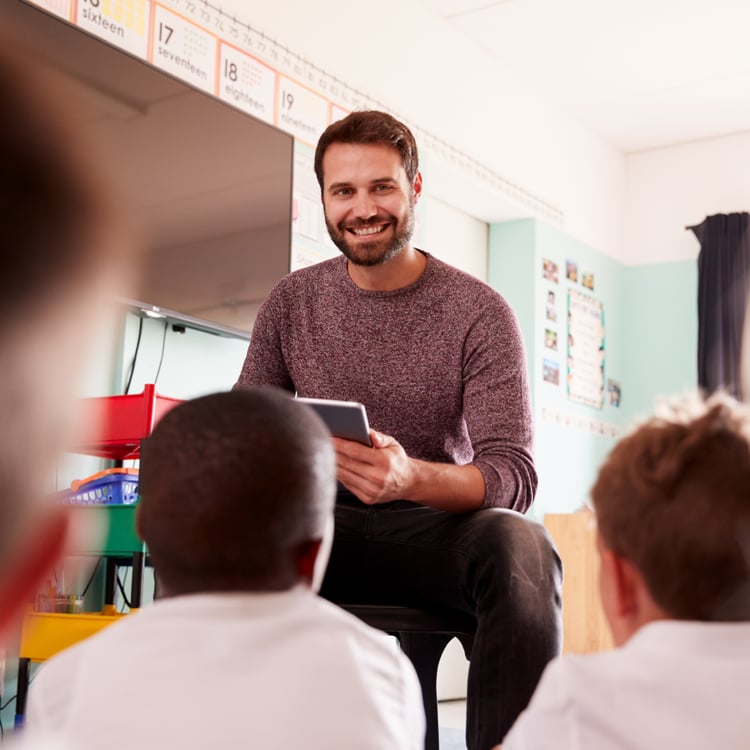 Teacher using online student registration software